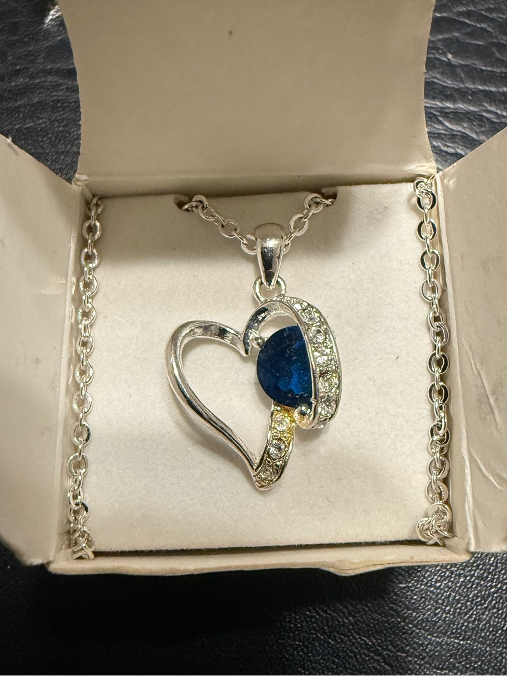 Vintage Avon looping open heart birthstone necklace.